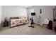 Bedroom with a cozy bed, desk, and exercise bike by a window at 315 Black Birch Dr, Summerville, SC 29486