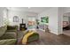 Bright living room features a fireplace, patio access, and hardwood floors at 315 Black Birch Dr, Summerville, SC 29486