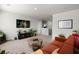 Upstairs living area features a comfortable sofa and media center with TV at 315 Black Birch Dr, Summerville, SC 29486