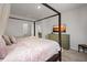 Spacious main bedroom with a canopy bed, en-suite bath, and dresser with TV at 315 Black Birch Dr, Summerville, SC 29486