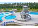 Aerial view of a pool area with a water slide, lounge chairs, and umbrellas at 315 Black Birch Dr, Summerville, SC 29486