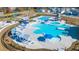 Aerial view of a pool area with lounge chairs, tables, and gazebos at 315 Black Birch Dr, Summerville, SC 29486
