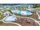 Aerial view of a pool area with a playground, beach volleyball court, and multiple pools at 315 Black Birch Dr, Summerville, SC 29486