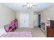 Comfortable bedroom with ceiling fan and ample closet space at 327 Freeland Way, Moncks Corner, SC 29461
