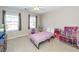 Bright bedroom with two windows and a ceiling fan at 327 Freeland Way, Moncks Corner, SC 29461