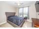 Cozy bedroom boasts natural light, neutral colors, and ample space for relaxation at 327 Freeland Way, Moncks Corner, SC 29461