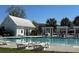 A pristine community pool with ample seating and a bath house cabana at 327 Freeland Way, Moncks Corner, SC 29461
