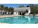 A pristine community pool with ample seating and a bath house cabana at 327 Freeland Way, Moncks Corner, SC 29461