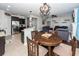 Open-concept dining area with seating, seamlessly connected to the kitchen and living spaces at 327 Freeland Way, Moncks Corner, SC 29461