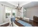 Dining room with dark hardwood floors and elegant chandelier, perfect for Gathering gatherings at 327 Freeland Way, Moncks Corner, SC 29461
