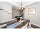 Home dining area showcasing the chandelier and hardwood floors in an open-concept layout at 327 Freeland Way, Moncks Corner, SC 29461