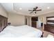 The primary bedroom features a ceiling fan, a spacious bed, and dressers with bathroom access at 327 Freeland Way, Moncks Corner, SC 29461