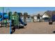 A community playground next to the community pool and bath house at 327 Freeland Way, Moncks Corner, SC 29461