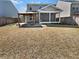 Backyard with covered patio, screened porch, mature trees, and a well-maintained lawn; perfect for Gathering gatherings at 359 Dunlin Dr, Summerville, SC 29486