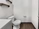 Modern half bathroom featuring wooden shelving and hardwood-style flooring at 359 Dunlin Dr, Summerville, SC 29486