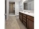 Bathroom featuring dual vanities, a glass shower, and neutral-toned flooring at 359 Dunlin Dr, Summerville, SC 29486