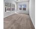 Spacious bedroom with neutral carpet, multiple windows with blinds, and a ceiling fan at 359 Dunlin Dr, Summerville, SC 29486
