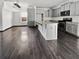 Eat in kitchen boasts gray cabinets, granite countertops, stainless steel appliances and hardwood floors at 359 Dunlin Dr, Summerville, SC 29486