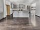 Kitchen boasts gray cabinets, granite countertops, stainless steel appliances, and hardwood flooring at 359 Dunlin Dr, Summerville, SC 29486