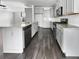 Modern kitchen featuring gray cabinets, granite countertops, stainless steel appliances, and hardwood flooring at 359 Dunlin Dr, Summerville, SC 29486