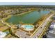 An aerial view of the community lake and pool featuring lush landscaping and a convenient parking area at 3858 Sawyers Island Dr, Mount Pleasant, SC 29466