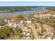 Community aerial view showcases waterfront homes and a beautiful landscape of marsh and river at 3858 Sawyers Island Dr, Mount Pleasant, SC 29466
