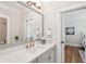 Modern bathroom features a quartz countertop vanity, brass hardware, and open doorway to bedroom at 3858 Sawyers Island Dr, Mount Pleasant, SC 29466