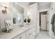 Well-lit bathroom with white marble countertops, decorative vanity, and view into the shower and toilet area at 3858 Sawyers Island Dr, Mount Pleasant, SC 29466