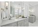 Bright bathroom with double vanity, marble countertop, and views of the soaking tub and glass shower at 3858 Sawyers Island Dr, Mount Pleasant, SC 29466