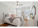 Bright bedroom with hardwood floors, white furnishings and a heart-shaped neon decoration at 3858 Sawyers Island Dr, Mount Pleasant, SC 29466