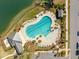 Aerial view of a resort-style swimming pool overlooking a private lake in this community at 3858 Sawyers Island Dr, Mount Pleasant, SC 29466