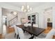 Dining room adjacent to entry with view of open staircase, white walls and modern lighting at 3858 Sawyers Island Dr, Mount Pleasant, SC 29466
