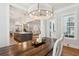 Dining room showcasing an open floor plan with views of the living room and modern white kitchen at 3858 Sawyers Island Dr, Mount Pleasant, SC 29466