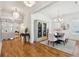 Open-concept dining area with stylish decor, an adjacent living space, and hardwood floors at 3858 Sawyers Island Dr, Mount Pleasant, SC 29466