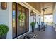 Inviting front door with a decorative wreath, elegant lanterns, and comfortable rocking chairs on the porch at 3858 Sawyers Island Dr, Mount Pleasant, SC 29466
