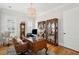 Well-appointed home office with custom built-ins, a stylish desk, and ample natural light at 3858 Sawyers Island Dr, Mount Pleasant, SC 29466