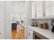 Bright kitchen offers a wine fridge, seamless countertops, and modern stainless steel appliances at 3858 Sawyers Island Dr, Mount Pleasant, SC 29466