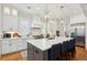 Kitchen boasts marble backsplash, an island with seating, and high-end stainless steel appliances at 3858 Sawyers Island Dr, Mount Pleasant, SC 29466