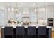 Eat-in kitchen features a gray island with seating, pendant lighting, and stainless steel appliances at 3858 Sawyers Island Dr, Mount Pleasant, SC 29466