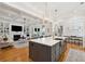 Open-concept kitchen with island, modern appliances, and seamless flow to the living area at 3858 Sawyers Island Dr, Mount Pleasant, SC 29466