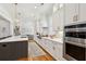 Modern kitchen with an island, marble backsplash, stainless steel appliances, and lots of cabinet space at 3858 Sawyers Island Dr, Mount Pleasant, SC 29466