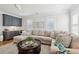 Inviting living room with bar, ample seating, hardwood floors, and great natural light at 3858 Sawyers Island Dr, Mount Pleasant, SC 29466