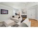 Spacious entertainment room includes bar, sofa, treadmill, and luxury vinyl flooring at 3858 Sawyers Island Dr, Mount Pleasant, SC 29466