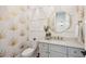 Chic powder room featuring gold-themed wallpaper and modern fixtures at 3858 Sawyers Island Dr, Mount Pleasant, SC 29466
