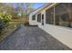 Backyard features a stone walkway leading to the screened porch at 418 Geddes Ave, Charleston, SC 29407