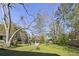 Backyard with a gazebo, mature trees, and a large green lawn at 418 Geddes Ave, Charleston, SC 29407