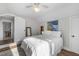 Cozy bedroom has a ceiling fan, neutral walls, hardwood floors and a large window at 418 Geddes Ave, Charleston, SC 29407