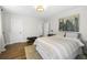 Cozy bedroom features hardwood floors, neutral colors, artwork, and soft natural light at 418 Geddes Ave, Charleston, SC 29407