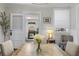 Bright dining room with hardwood floors that transition to a brick sunroom at 418 Geddes Ave, Charleston, SC 29407