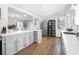 Spacious kitchen features stainless appliances, gray cabinets, quartz countertops, and hardwood floors at 418 Geddes Ave, Charleston, SC 29407